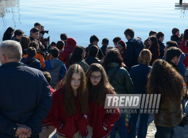 Baku residents bringing flowers to Seaside Boulevard to honor missing oil workers.  Azerbaijan, Dec.07, 2015